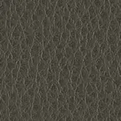 Dark gray textured material with interwoven linear pattern, matte finish, resembling synthetic leather; handwritten notation visible.